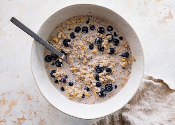 A bowl of overnight oats with blueberries.