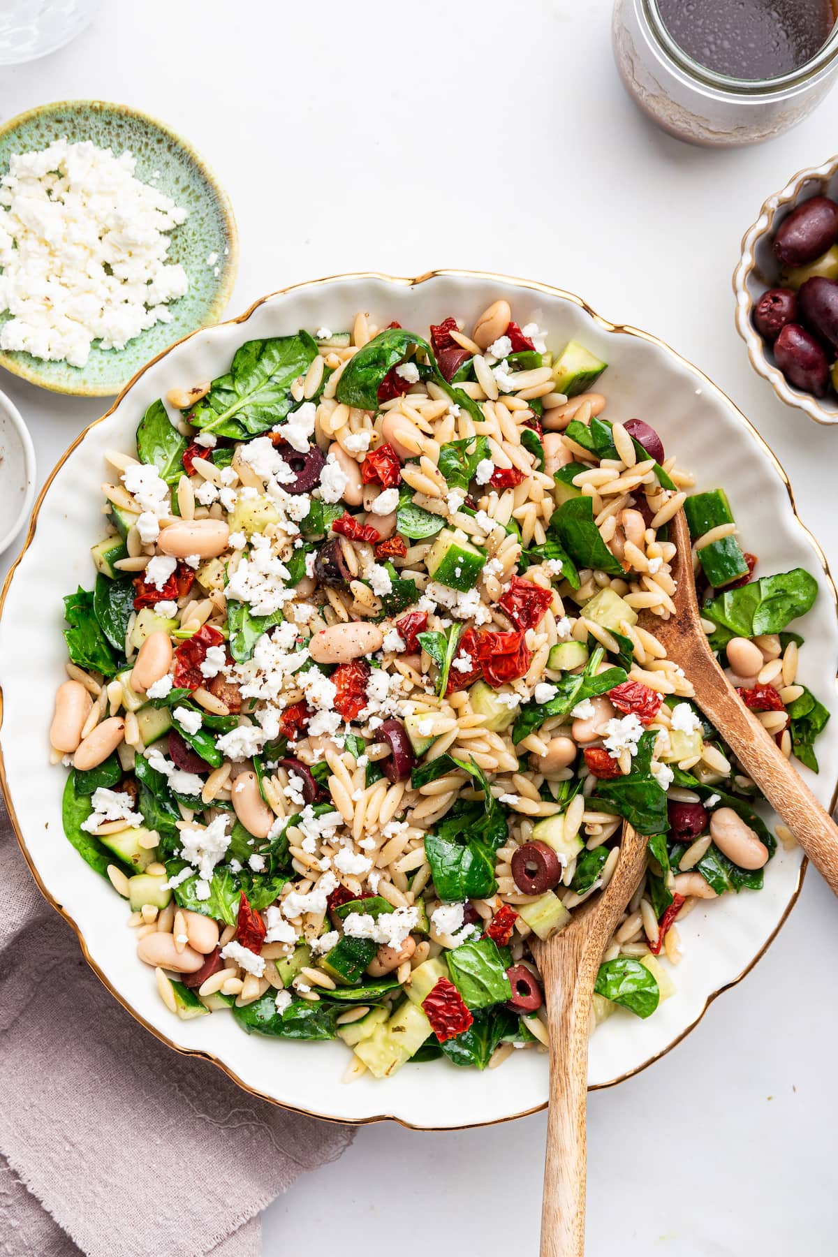 A large bowl of mediterranean orzo salad.