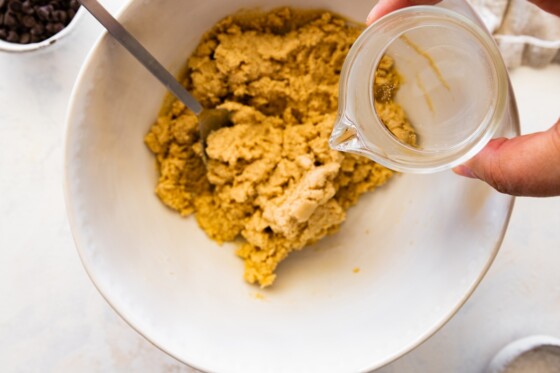Water being added to the protein cookie dough bark dough.