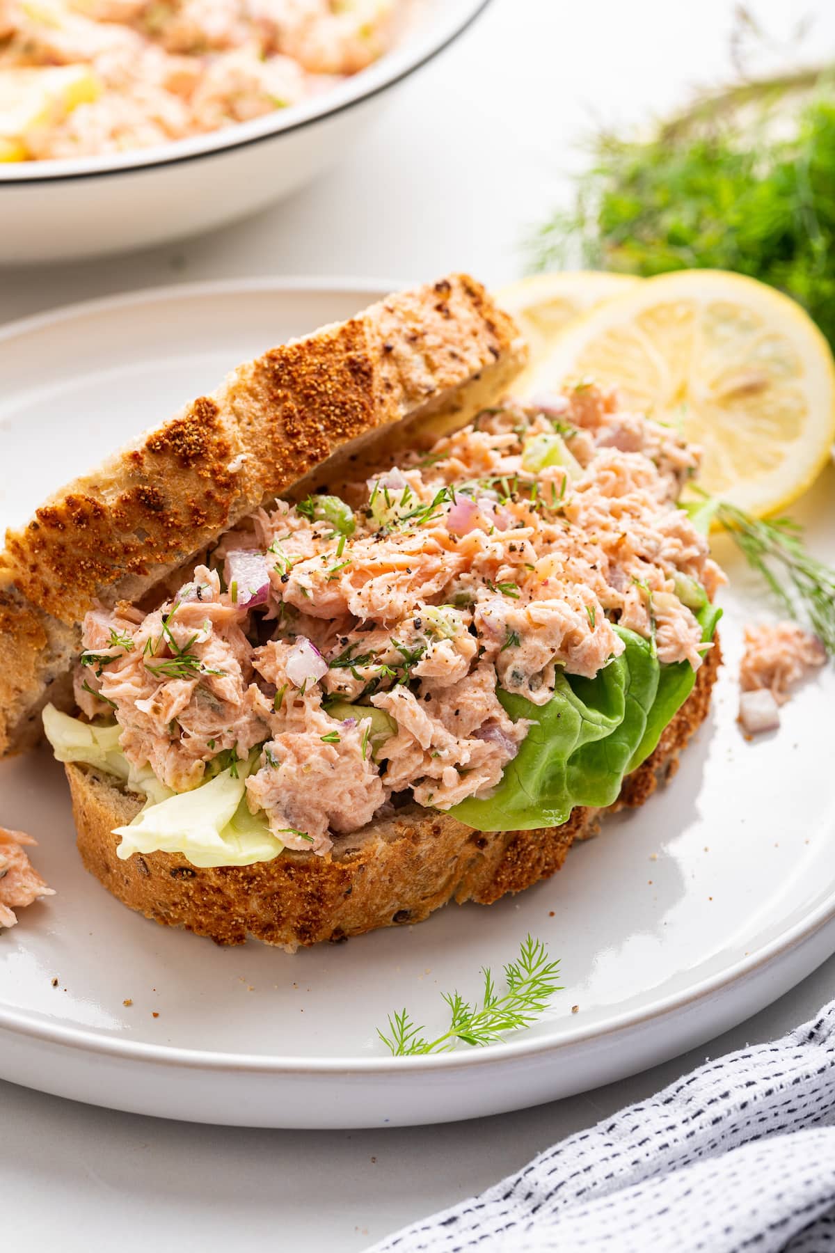 Salmon salad on a slice of bread.