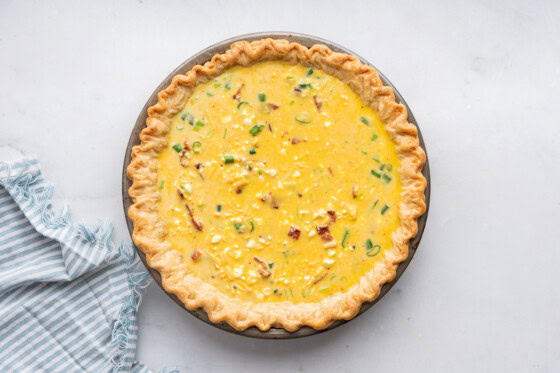 Cottage cheese quiche in a pan before being baked.