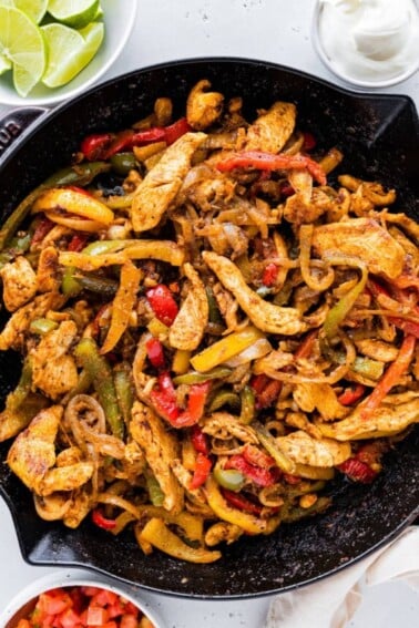 Chicken fajita mix in a cast iron skillet.