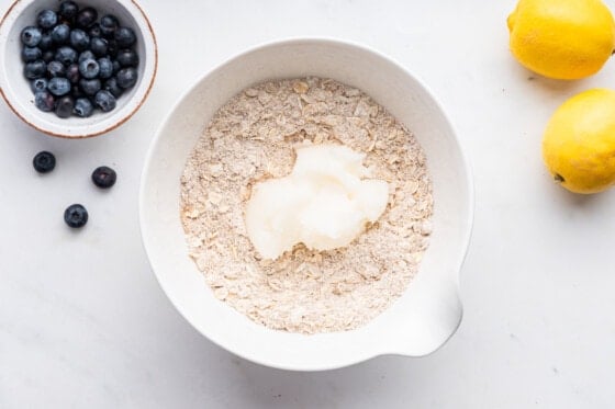 Dry ingredients for blueberry crumble bars in a mixing bowl.