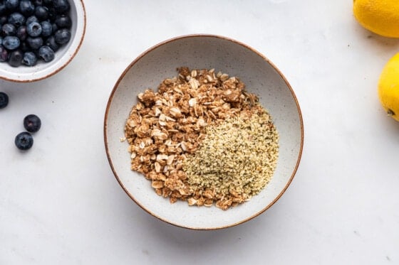 Dry ingredients for blueberry crumble bars in a mixing bowl.