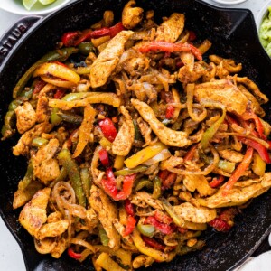 Chicken fajita mix in a cast iron skillet.