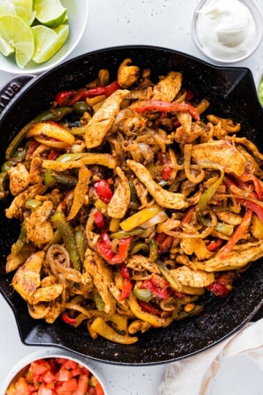 Chicken fajita mix in a cast iron skillet.