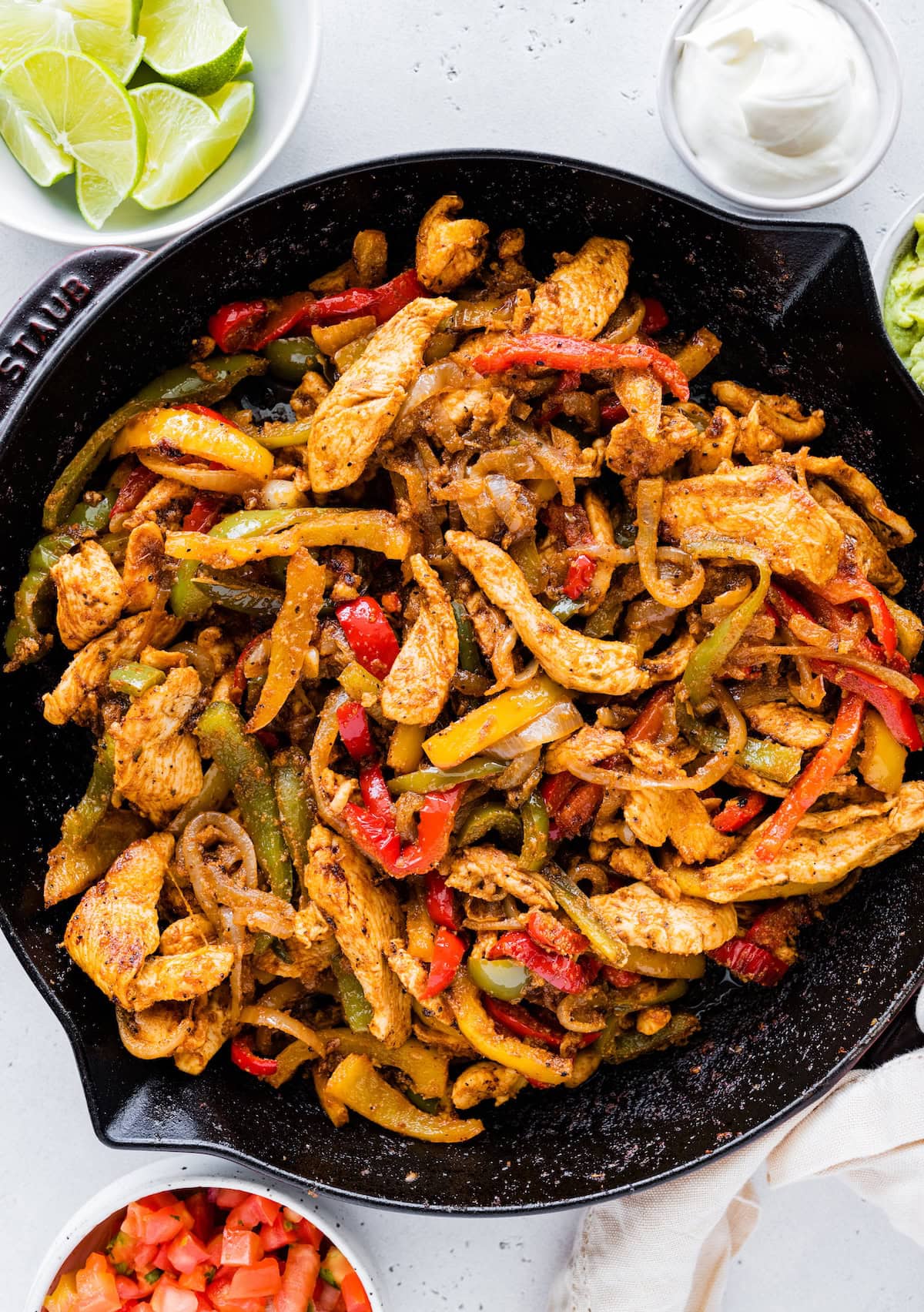 Chicken fajita mix in a cast iron skillet.