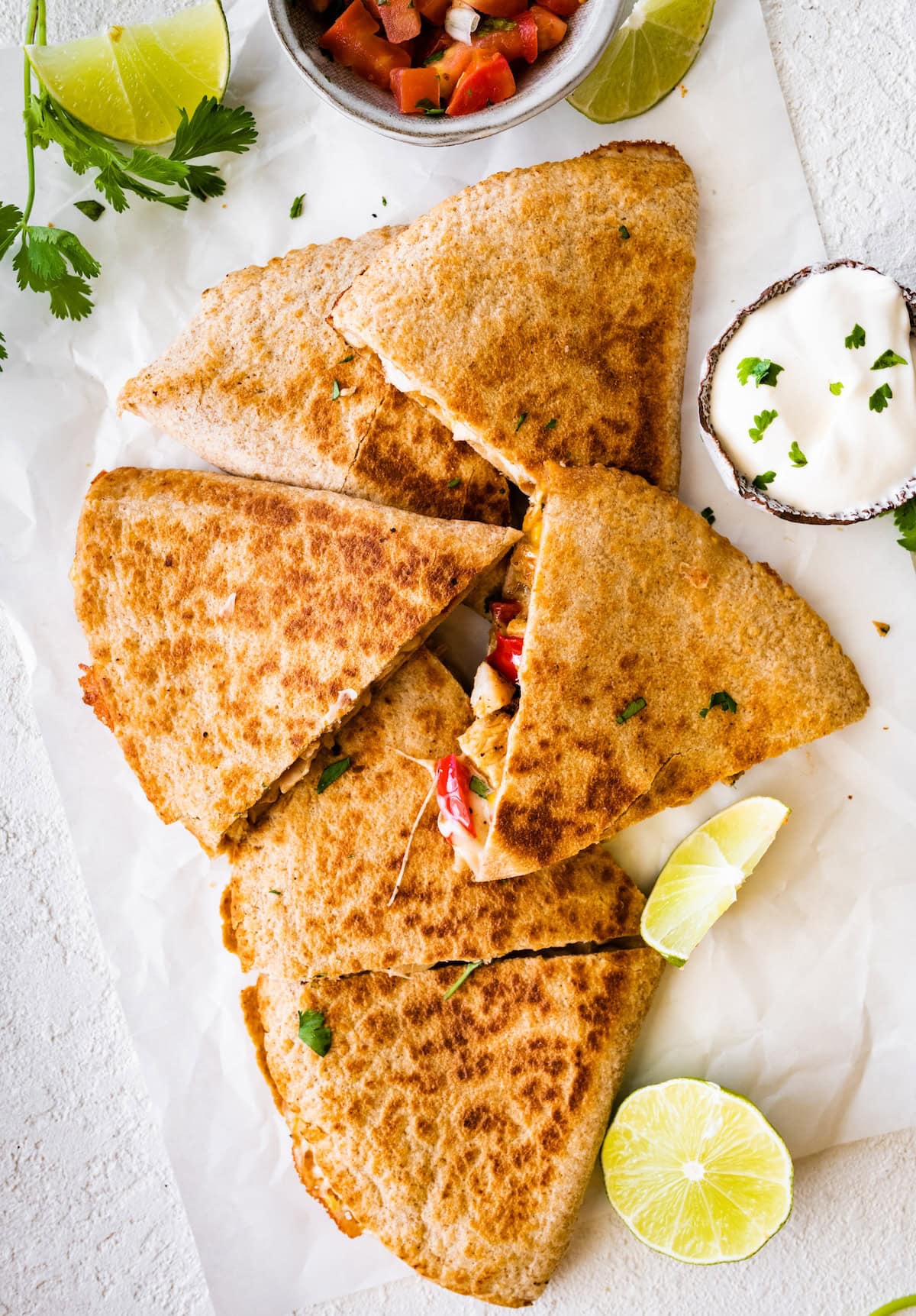 Healthy chicken quesadilla on parchment paper.