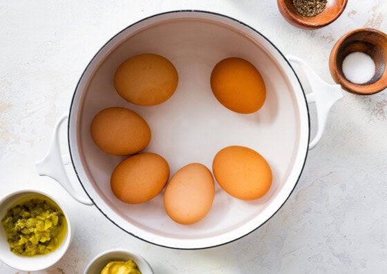 Eggs in a pot of water.