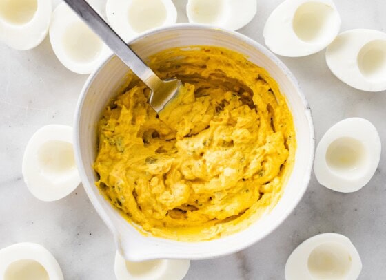 A deviled egg mixture in a large mixing bowl.
