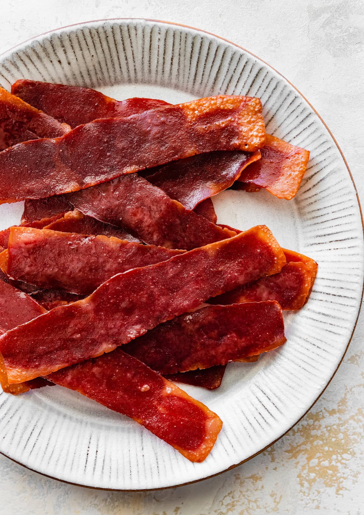 Turkey bacon on a white plate.