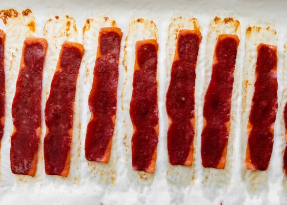 Baked turkey bacon on a baking tray.