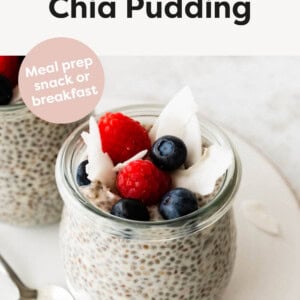 Coconut Chia Pudding in a jar topped with berries and coconut flakes.