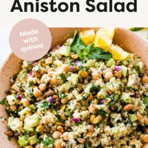 Bowl of Jennifer Aniston Salad garnished with mint and lemon.