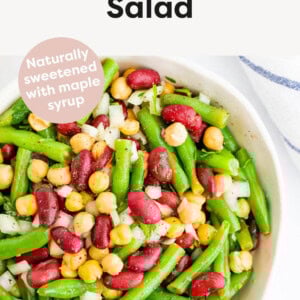 Three Bean Salad in a bowl made with chickpeas, kidney beans, green beans and onion.