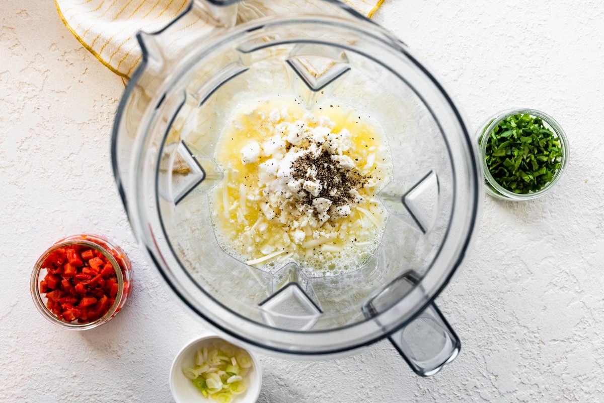 Egg whites, cheese, and spices in a blender.