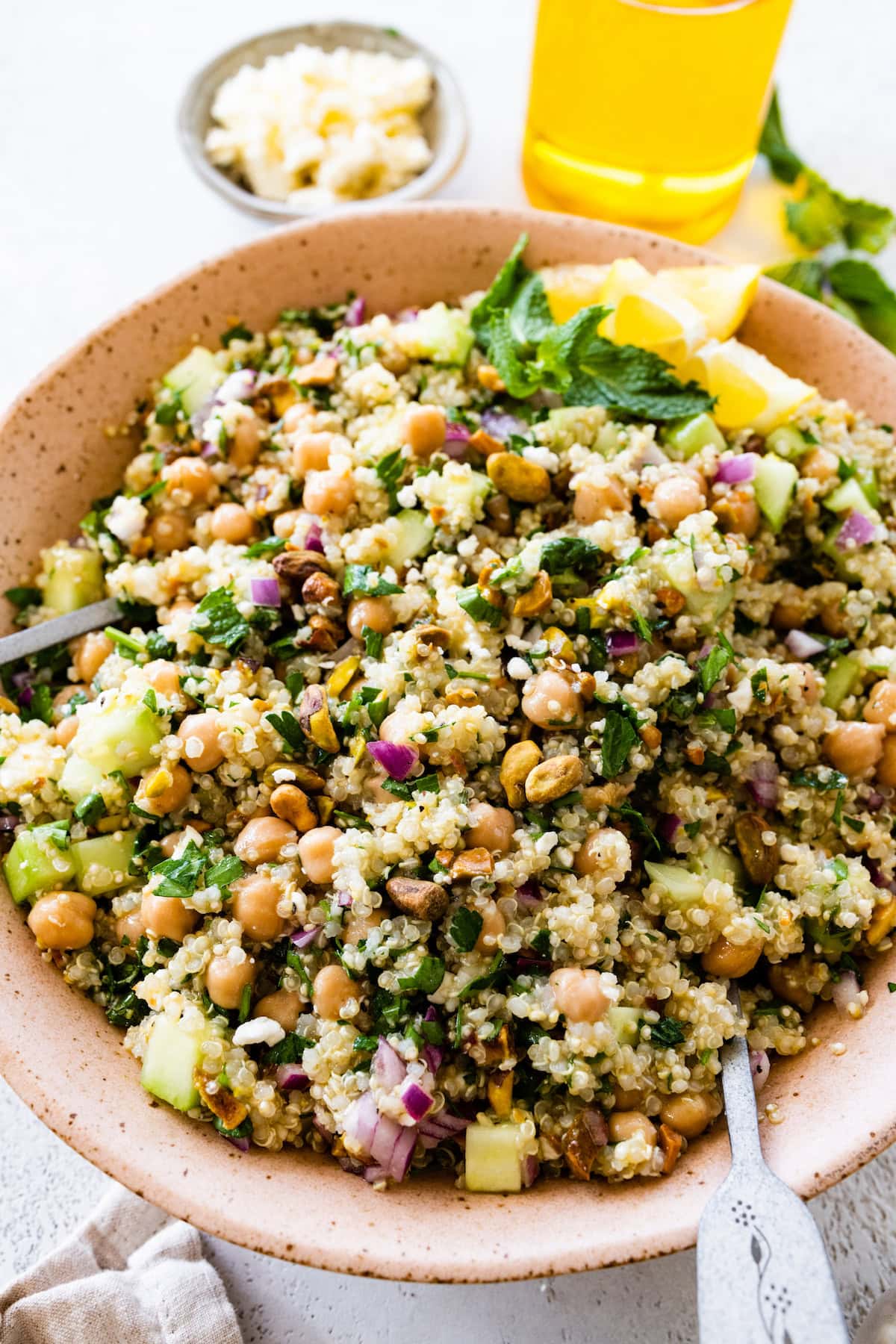 Jennifer Aniston salad with quinoa, chickpeas, feta and pistachios in a serving bowl.