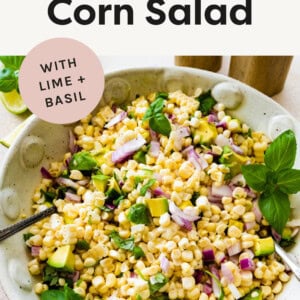 Avocado Corn Salad in a serving bowl with a spoon.