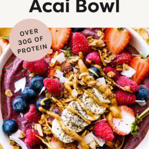 Protein Acai Bowl topped with fruit, coconut , granola and nut butter.