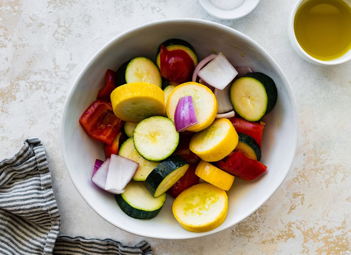 Chopped vegetables in a bowl used for grilled chicken kabobs.