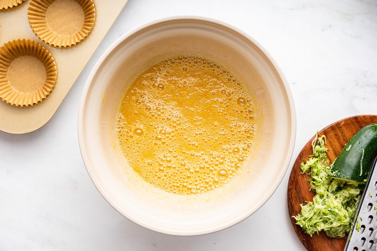 A large mixing bowl of liquid eggs.