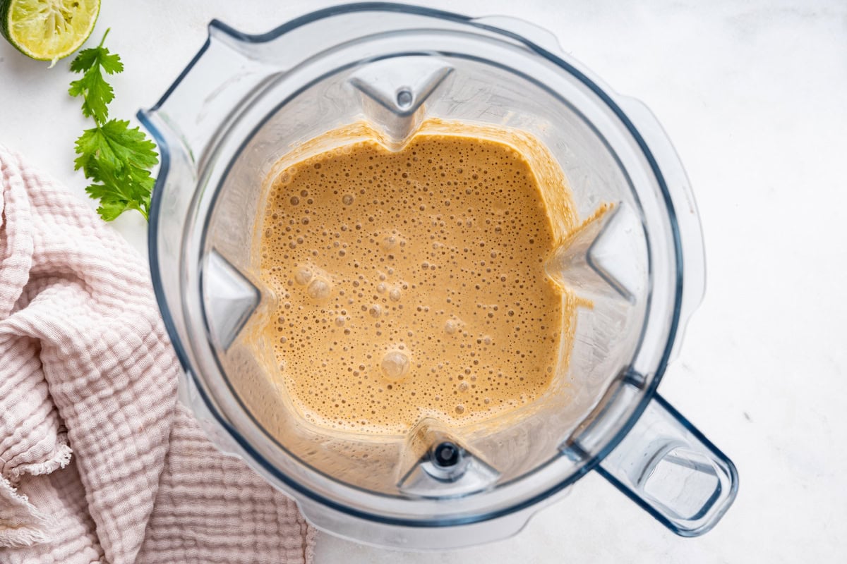 The blended southwest dressing in the base of a blender.