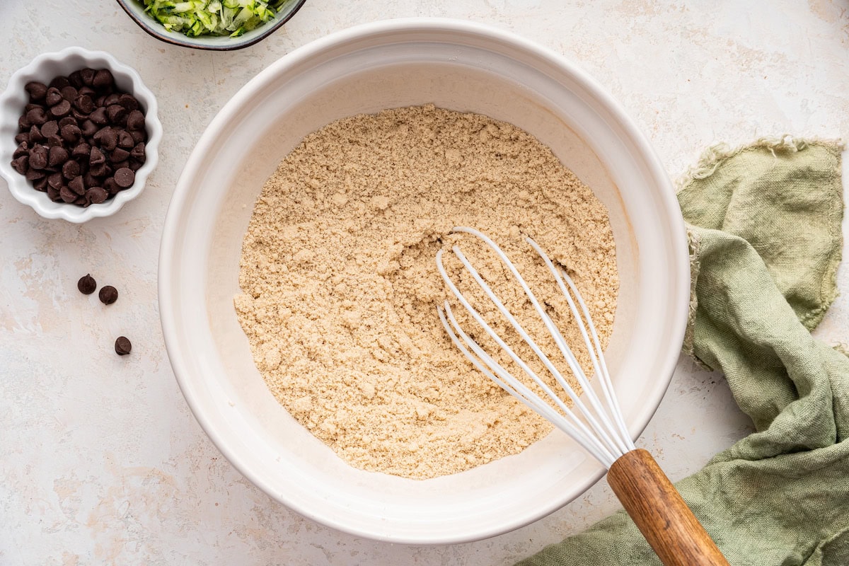 Dry ingredients in a large mixing bowl used for vegan zucchini bread.