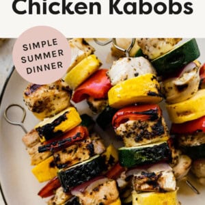 Plate of chicken and veggie kabobs.