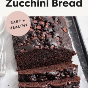 Chocolate Zucchini Bread loaf with slices taken out of it.