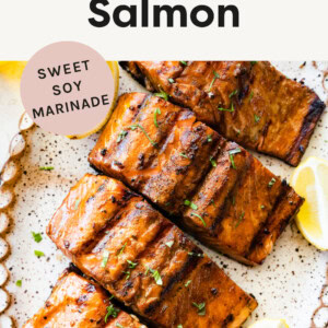 Four pieces of Grilled Salmon on a platter.