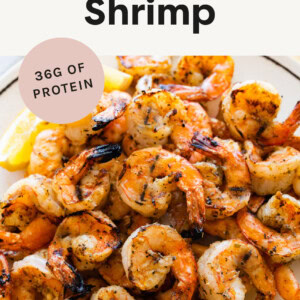 Plate of Grilled Shrimp served with lemon wedges.
