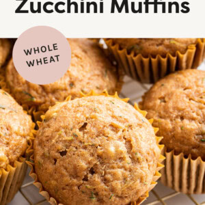 Healthy Zucchini Muffins on a gold cooling rack.