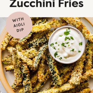 Plate of Crispy Baked Zucchini Fries with aioli dipping sauce.