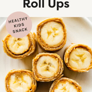 Banana Sushi Roll Ups on a plate. Tortilla wrapped around banana slices with nut butter.