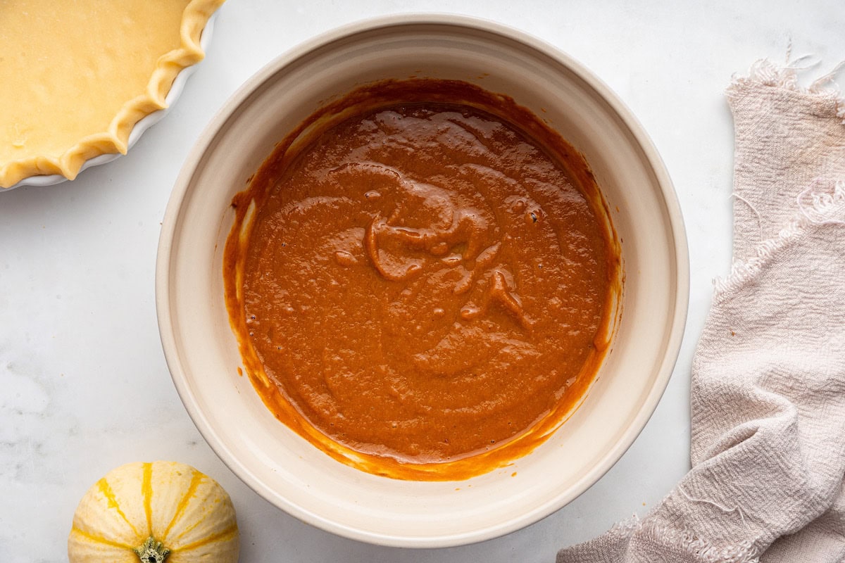 A large bowl of pumpkin pie batter.
