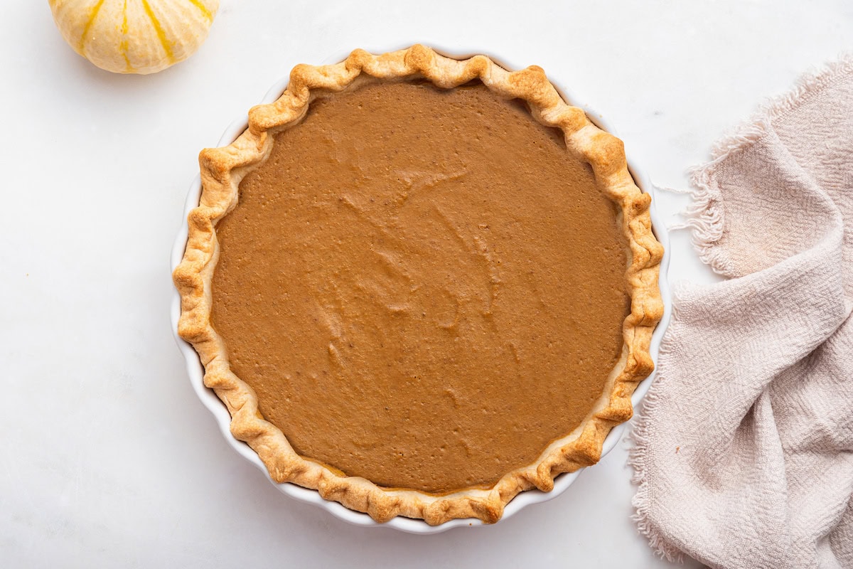 A pumpkin pie after being baked in the oven.
