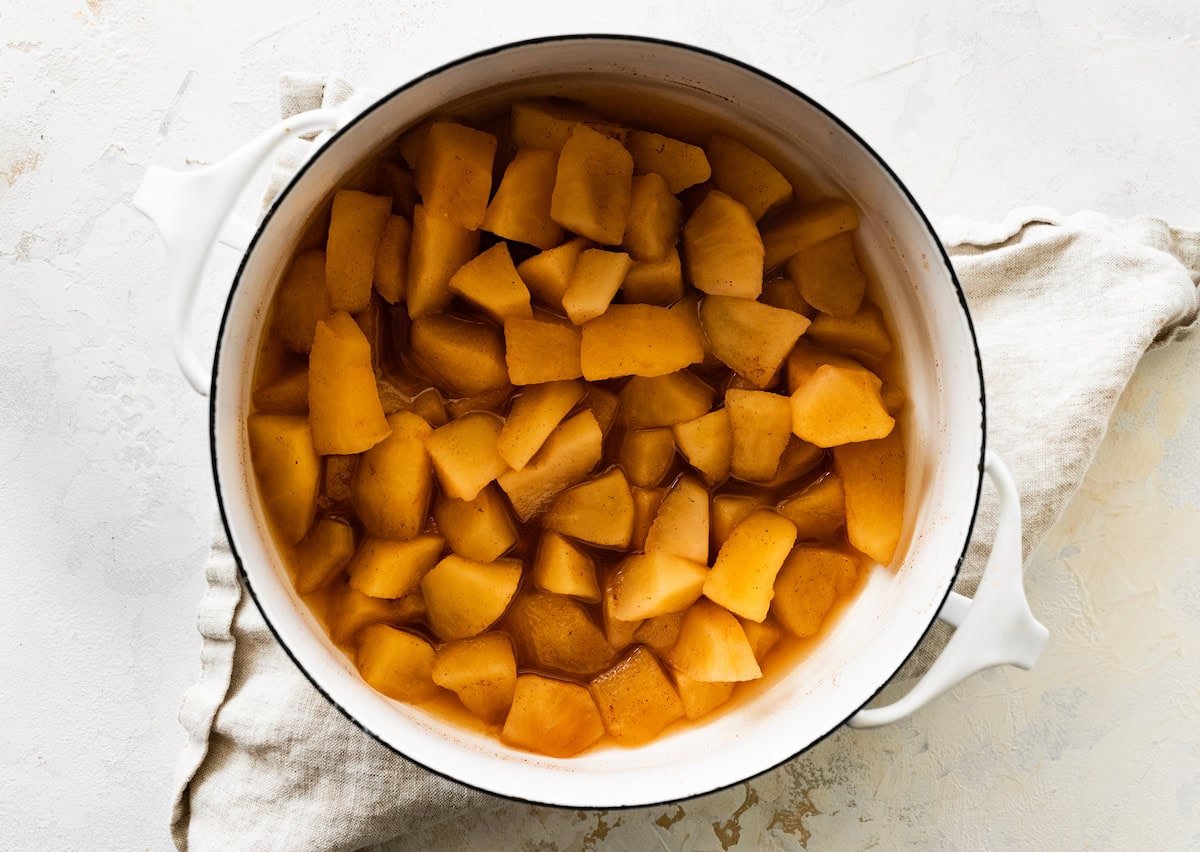 Cinnamon apple chunks in a large pot.