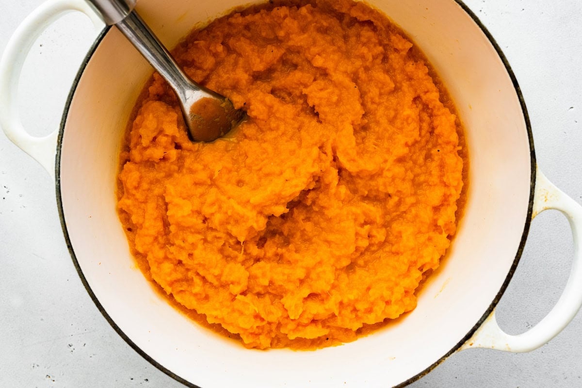 Mashed sweet potato in a large pot.