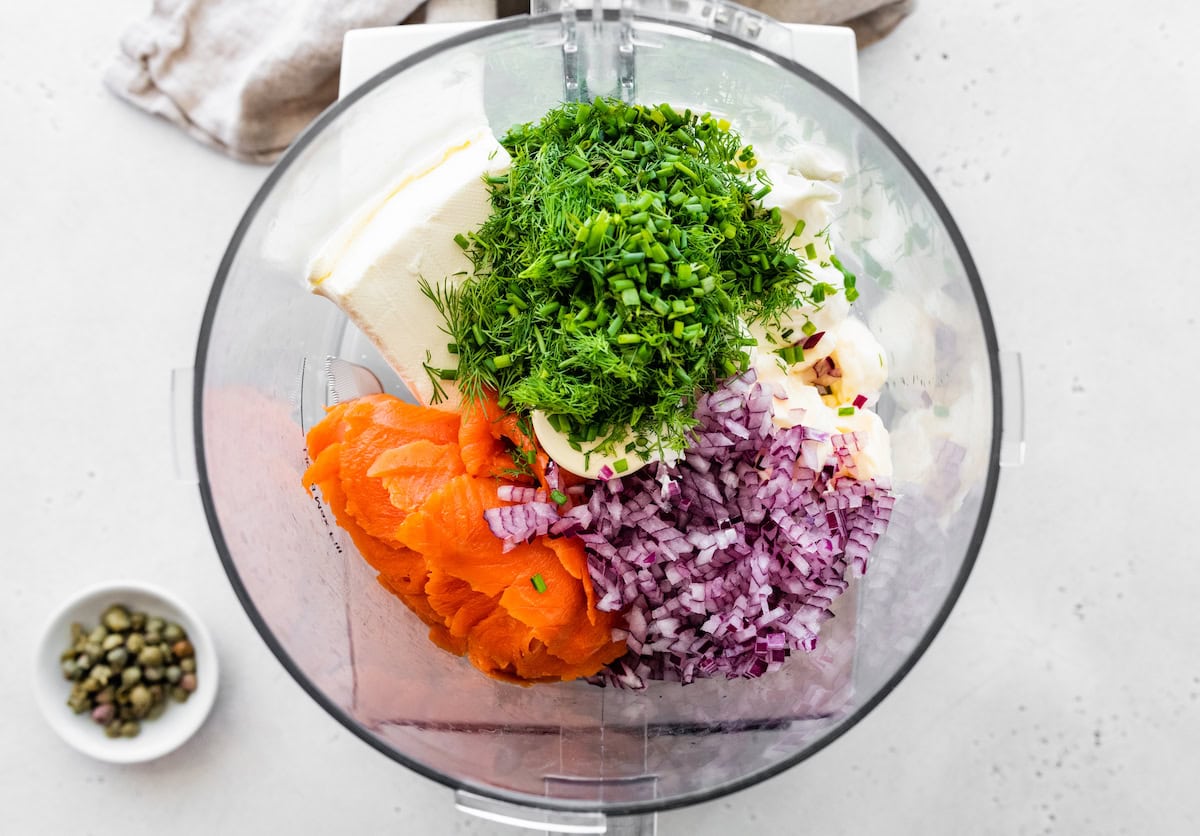 Salmon, cream cheese, yogurt, oil, onion, and fresh herbs in a food processor.