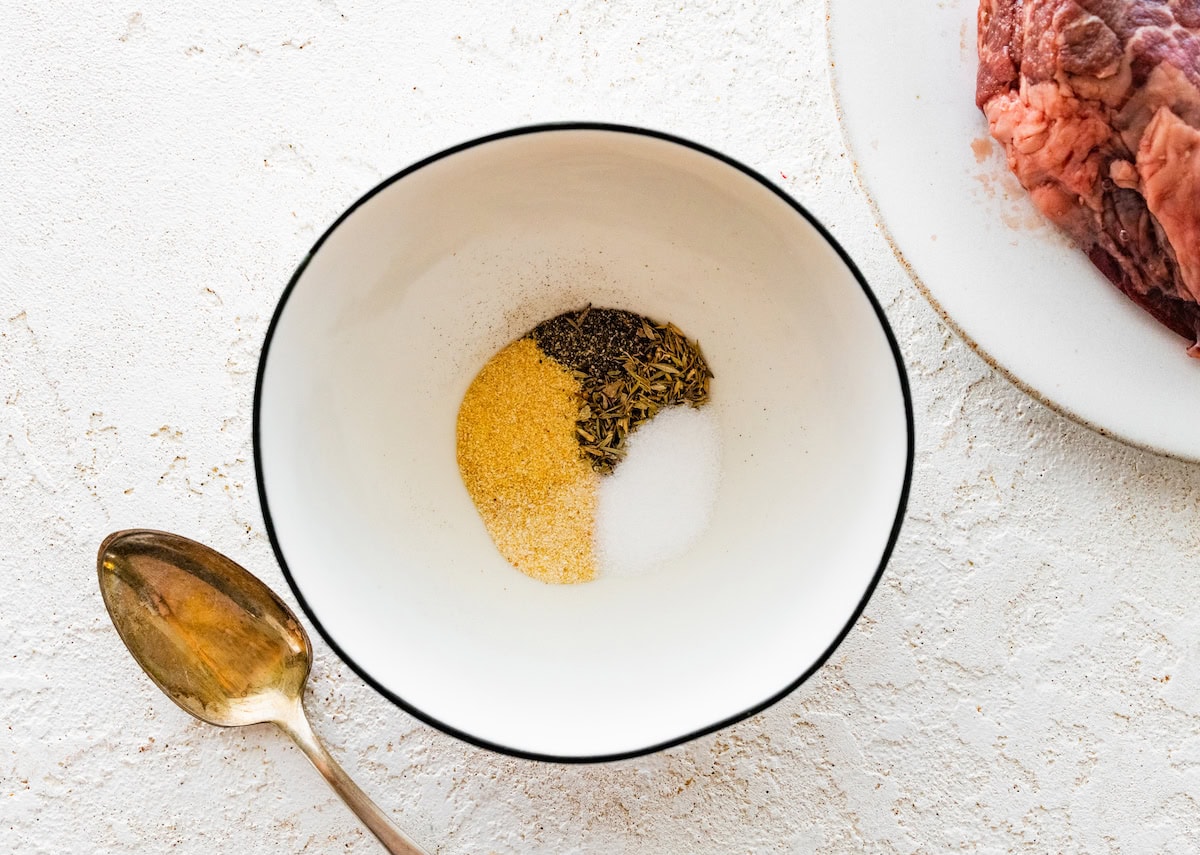 Seasonings for the air fryer filet mignon in a small white bowl.