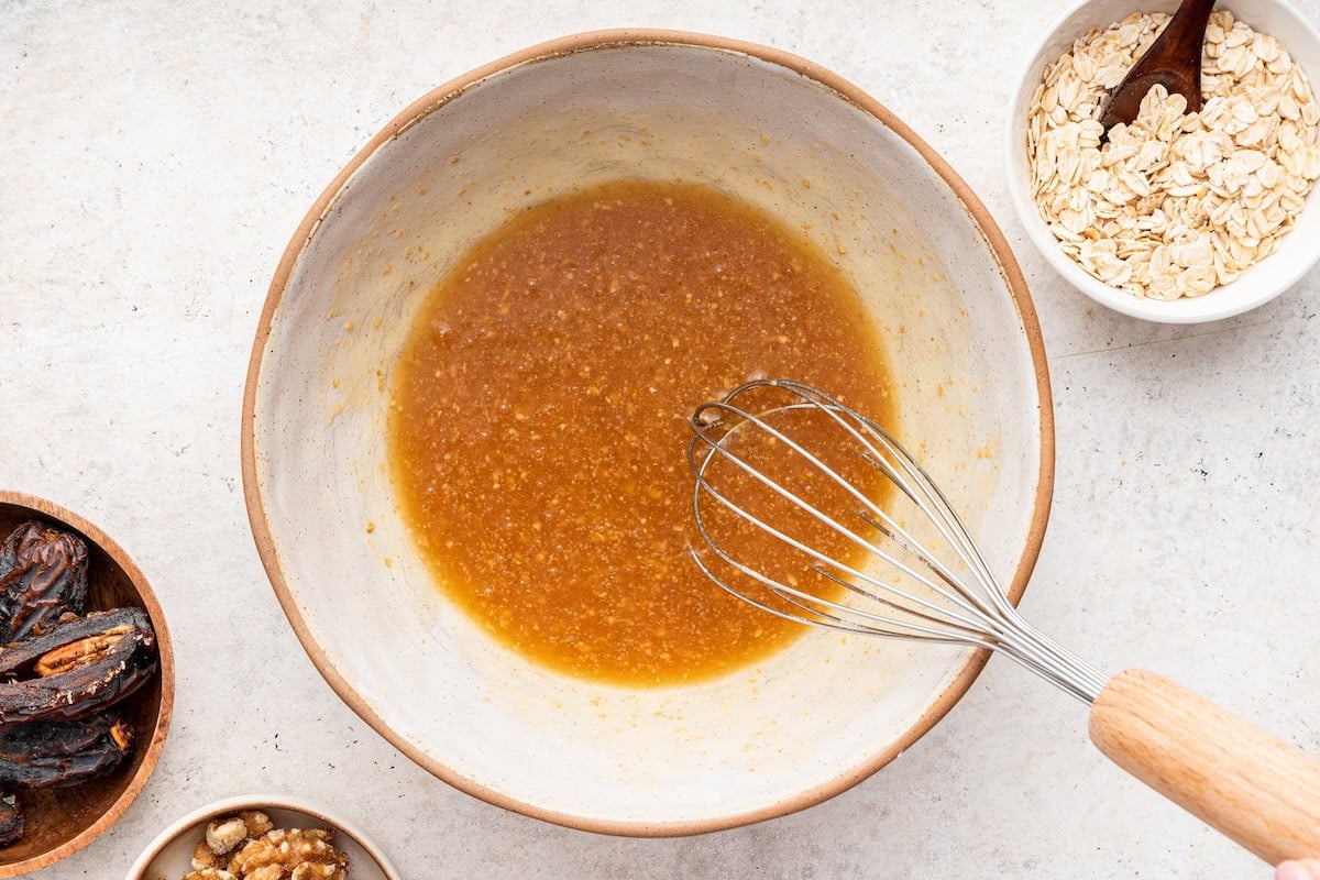 A flax egg mixed together in a small ceramic bowl.