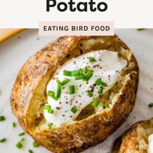 Oven Baked Potato topped with sour cream, chives and pepper.