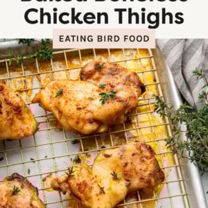 Baked Boneless Chicken Thighs on a wire rack on a sheet pan for baking.