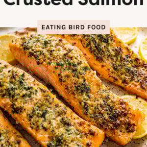 One photo of the Parmesan Crusted Salmon laid out on a a plate with lemons