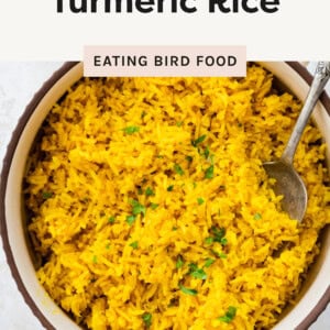 Overhead shot of the Turmeric Rice with a spoon in it in a bowl.