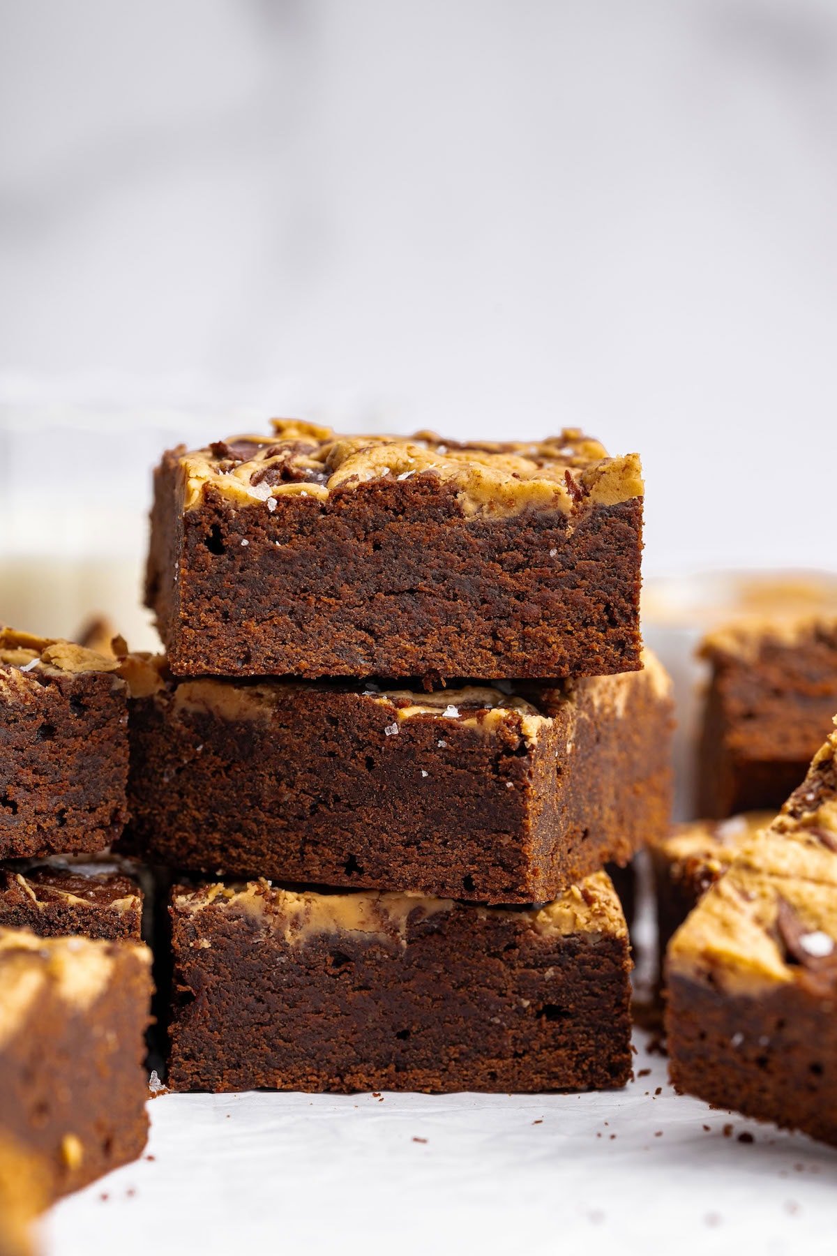 Three peanut butter brownies stacked on top of each other.