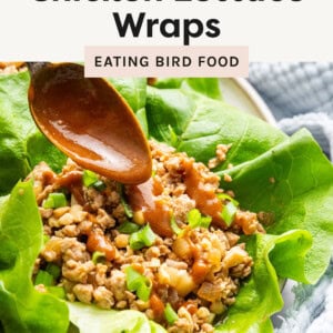 This image shows Asian Chicken Lettuce Wraps served on a plate. The wraps are made using fresh, crisp lettuce leaves filled with a flavorful mixture of ground chicken, water chestnuts, onions, and a savory sauce.
