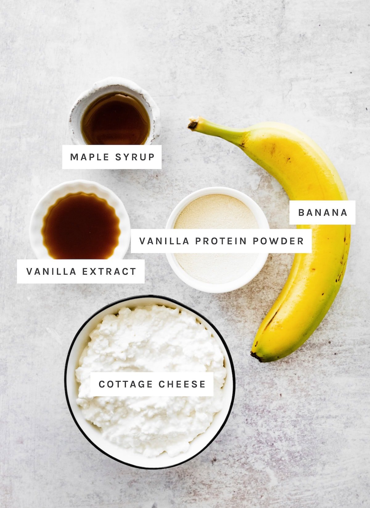 High Protein Banana Pudding ingredients: Maple syrup, banana, vanilla protein powder, vanilla extract, cottage cheese