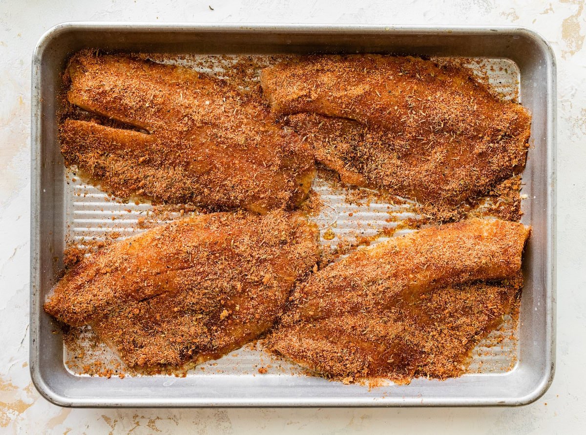 Four tilapia filets coated with the blackened seasoning mixture.