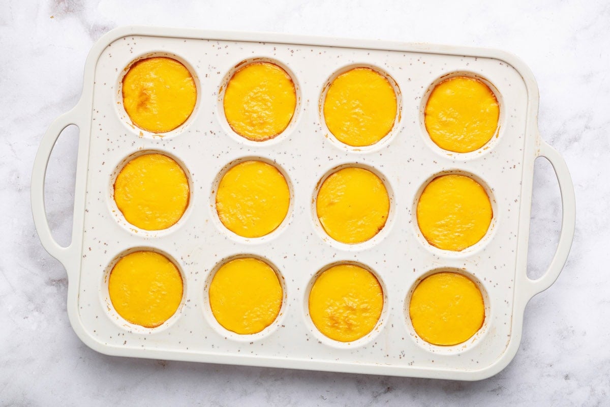 12 cottage cheese egg bites after baking in a silicone muffin tray.